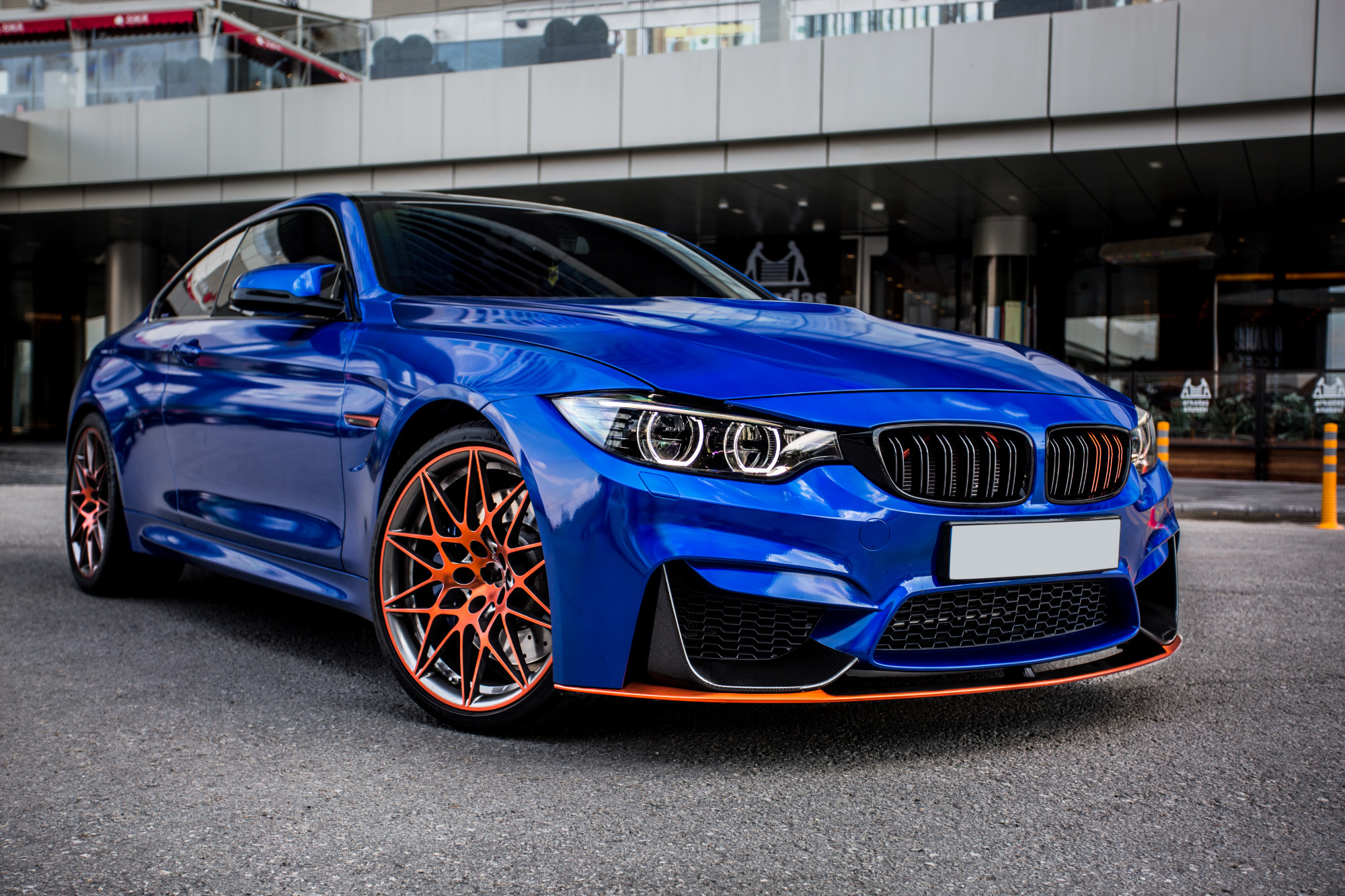 blue-sport-sedan-parked-yard