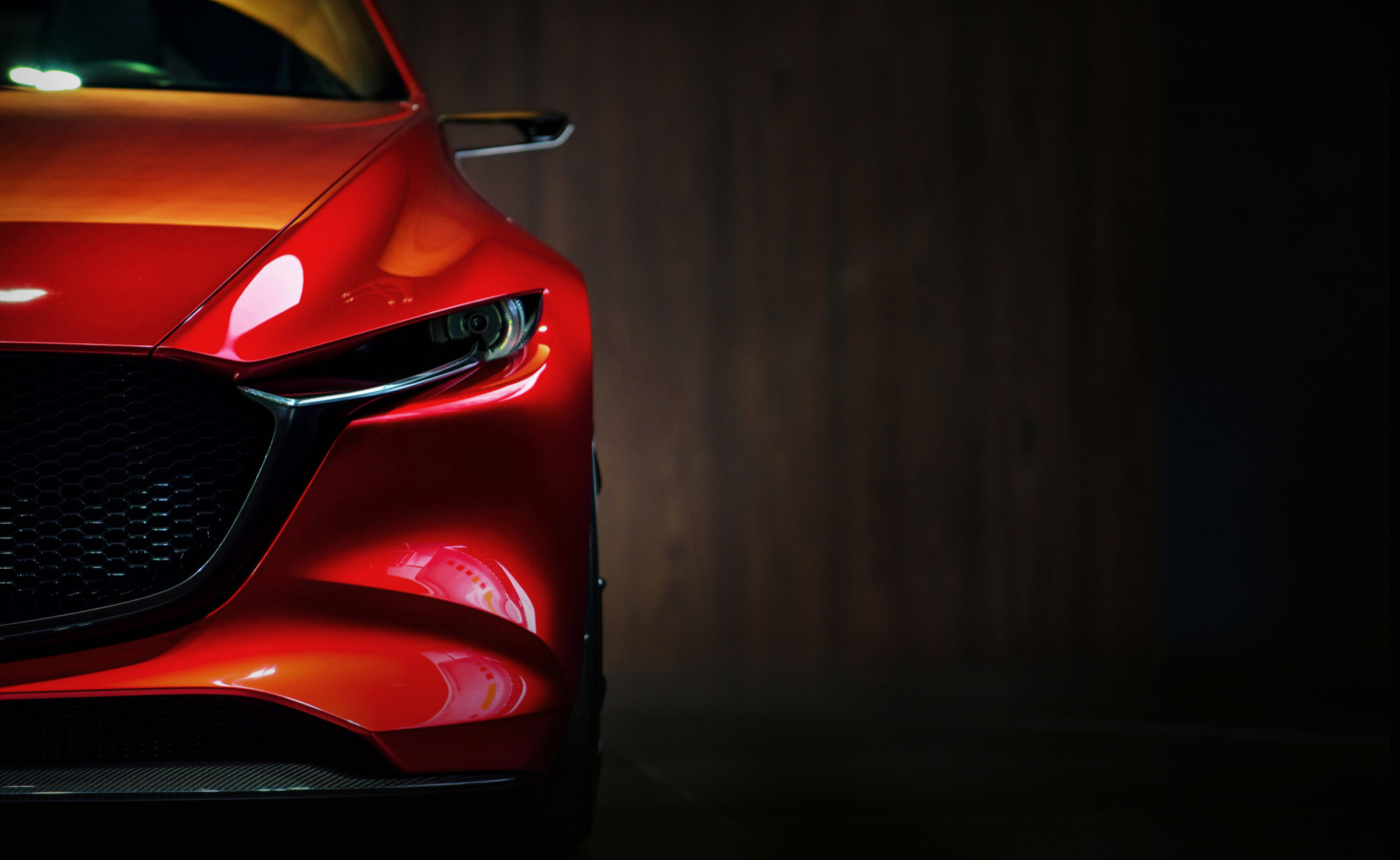 red-modern-car-headlights-black-background